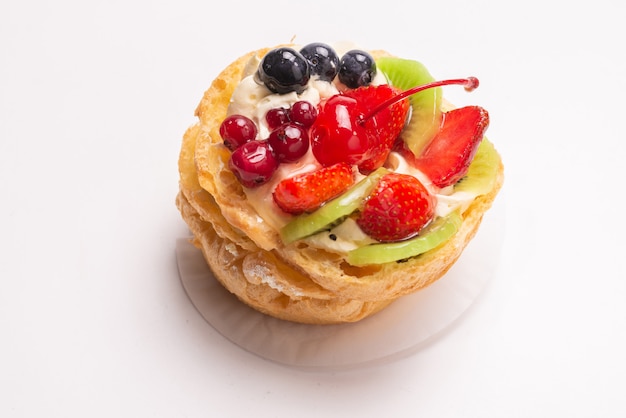 Home made cake with cream and fruits isolated 