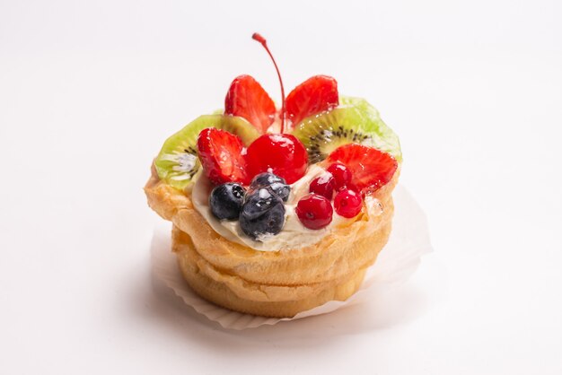 Home made cake with cream and fruits isolated 