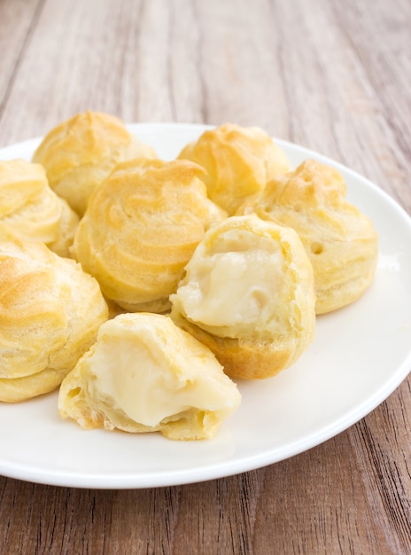 Home made choux cream on white plate. 