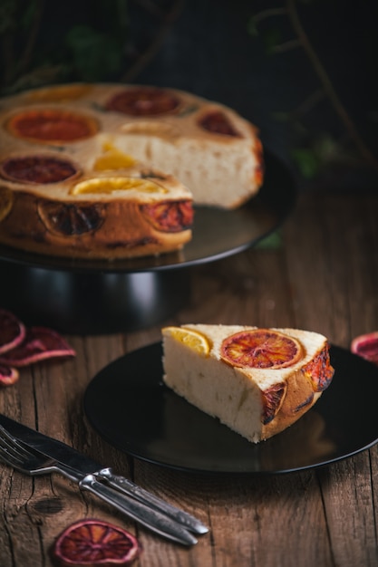 Home made citrus cake on wooden table in rustic style