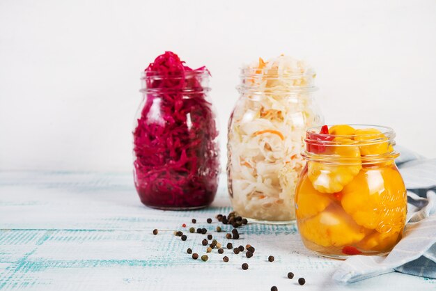 Home-made fermented vegetables in jars, cabbage, carrots, beets, squash