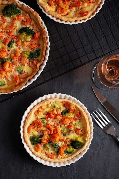 Home made french tart quiche with crayfish and broccoli filled with cream and eggs.