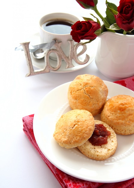 Home made scones with strawberry jam and a cup of tea