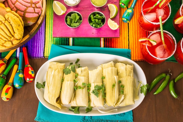 Home made tamales on serving plate on the party table.