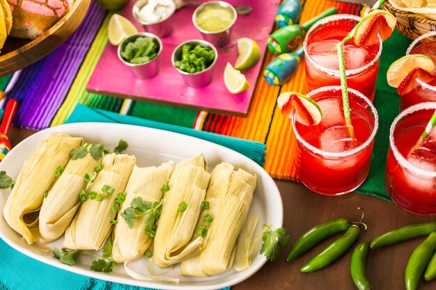 Home made tamales on serving plate on the party table.