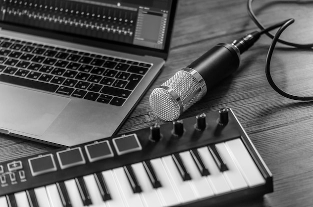 Photo home music studio microphone midi keyboard laptop