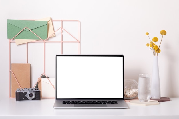 Home office desk interior. Stylish workplace with photo camera, mockup front view.