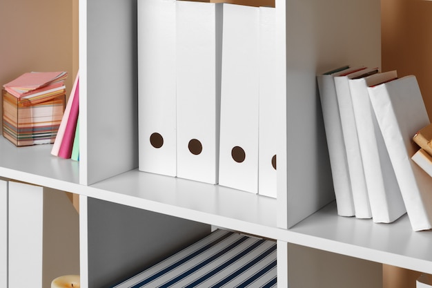 Home office working space. white shelf with accessories