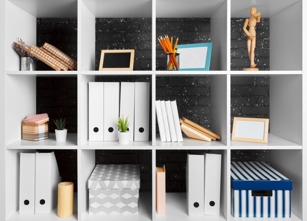 Photo home office working space. white shelf with accessories