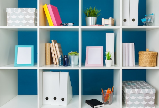 Home office working space. white shelf with accessories