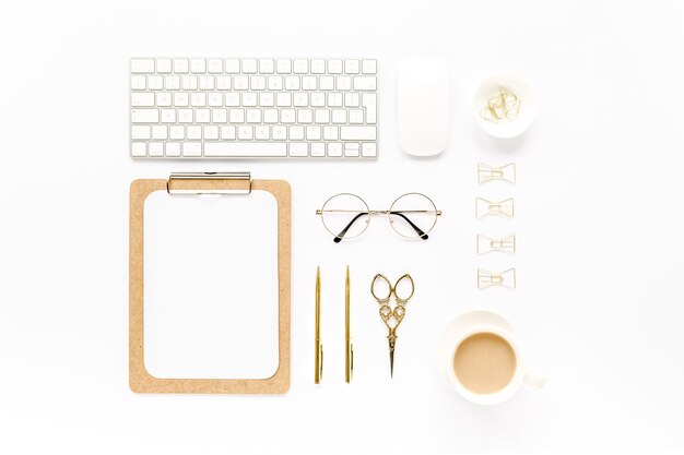 Home office workspace with computer clipboard laptop and golden accessories on white background flat