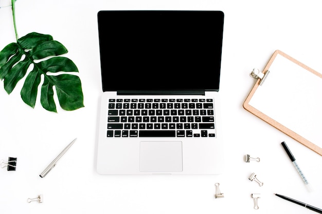 Home office workspace with laptop blank screen