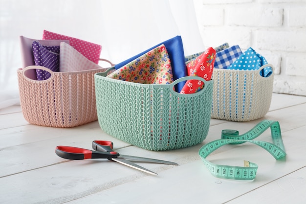 Photo home organizers colored baskets on white table