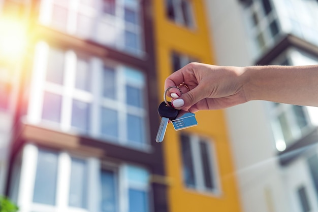 Home owner man or realtor or buyer showing bunch of keys to\
apartment or rental house