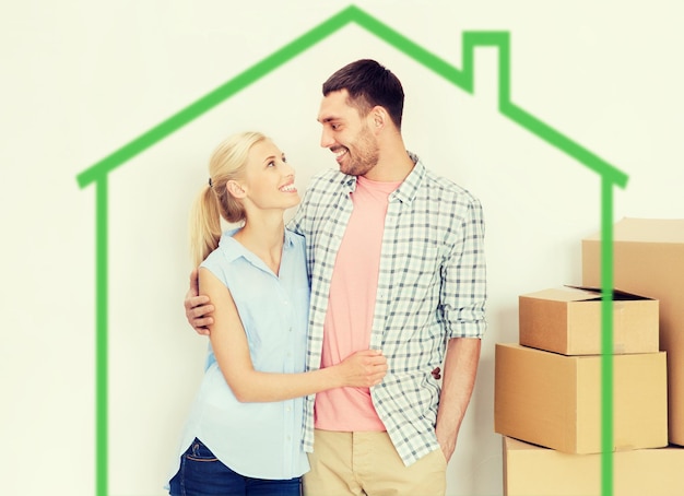 home, people, repair and real estate concept - happy couple with many cardboard boxes moving to new place