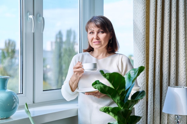 Home portrait of mature woman looking at the camera