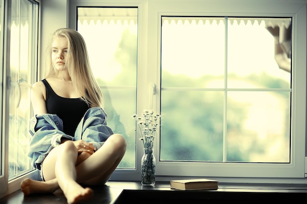 Home portrait of a young blonde girl