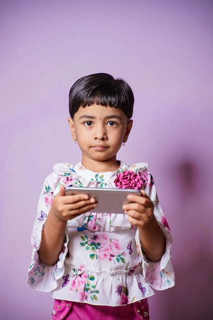 Home schooling Asian little young girl student learning virtual internet online class