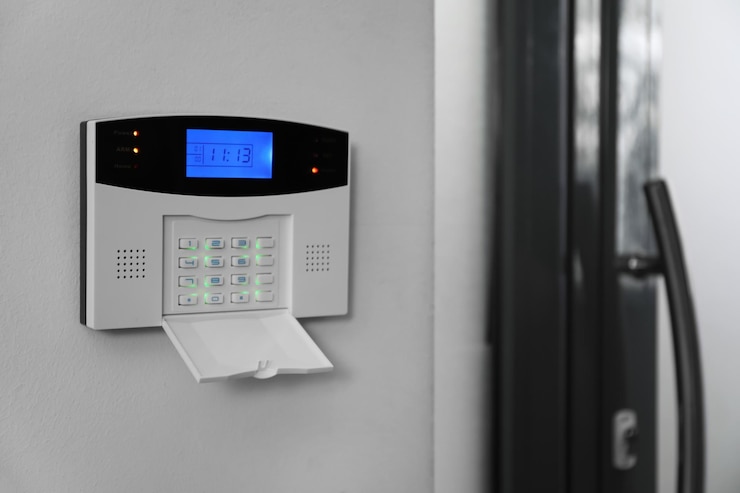 Photo home security system on white wall indoors space for text