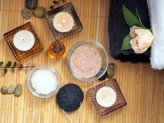 Home skin care Himalayan salt sea salt almond oil towels and candles Flat lay