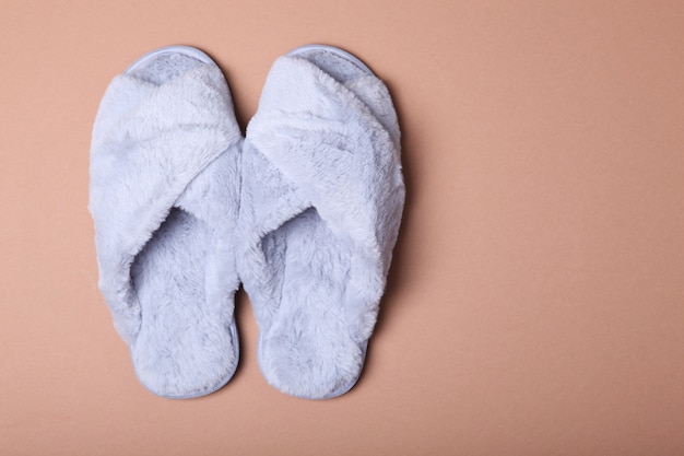 Home slippers closeup top view closeup on a colored background