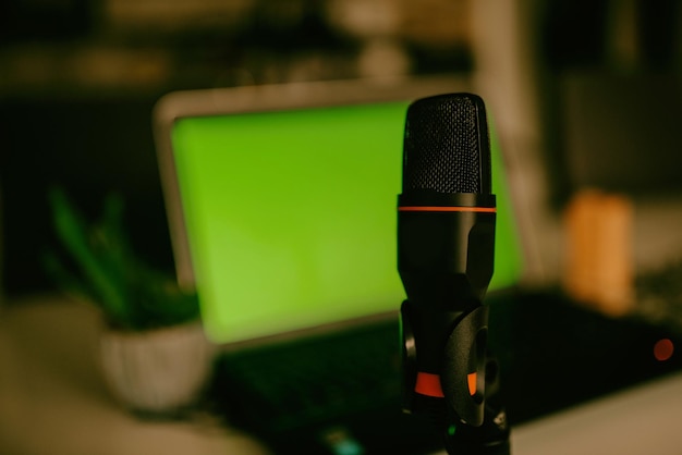 Home studio podcast interior Microphone laptop and on air lamp on the table closeup