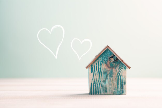 Home sweet home, house wood with heart shape