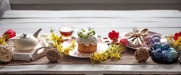 Home table setting for Easter holiday. The concept of a family holiday and decor.