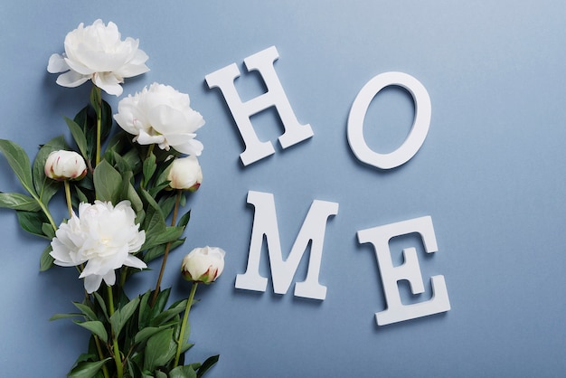 Home wooden word with white peonies