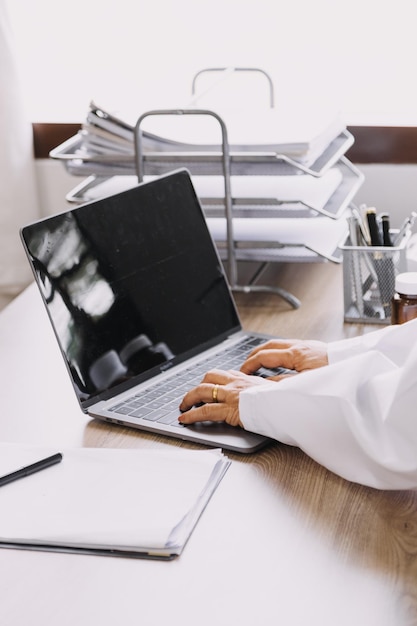 Homecare nursing service and elderly people cardiology healthcare Close up of young hispanic female doctor nurse check mature caucasian man patient heartbeat using stethoscope during visit