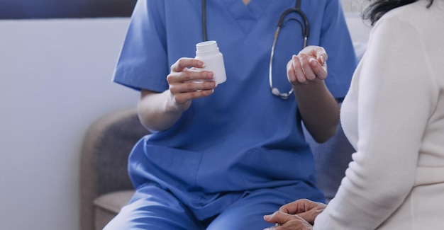 Homecare nursing service and elderly people cardiology healthcare Close up of young hispanic female doctor nurse check mature caucasian man patient heartbeat using stethoscope during visit