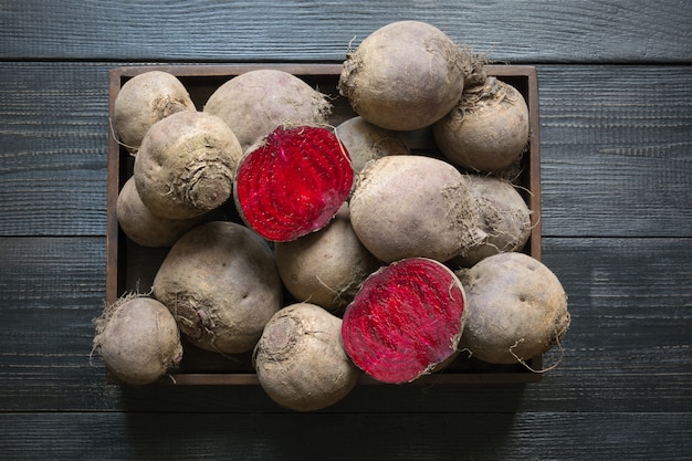 Homegrown beetroot in tray on wooden board. Autumn harvest