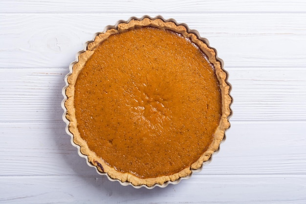 Homemade american traditional pumpkin pie Autumn food background