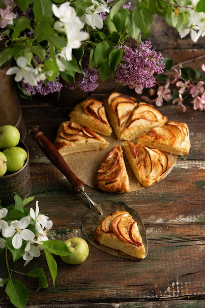 homemade apple cinnamon scones with lilac flowers and apple blooming branches