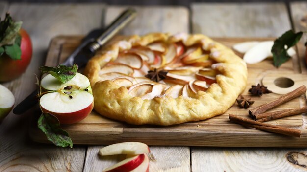 Homemade apple galette on a wooden board