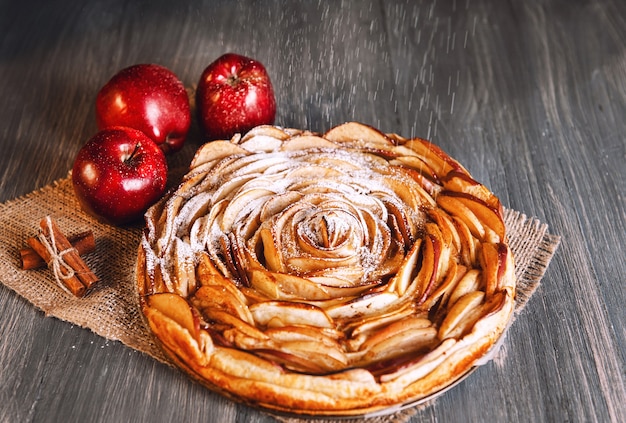 Homemade apple pie isolated on wooden background