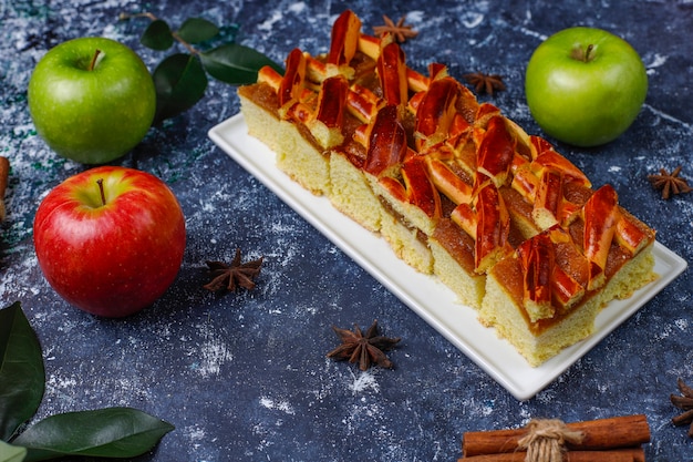 Homemade apple pie slices on dark, top view