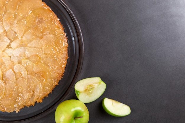 Homemade apple pie on a stone countertop. 