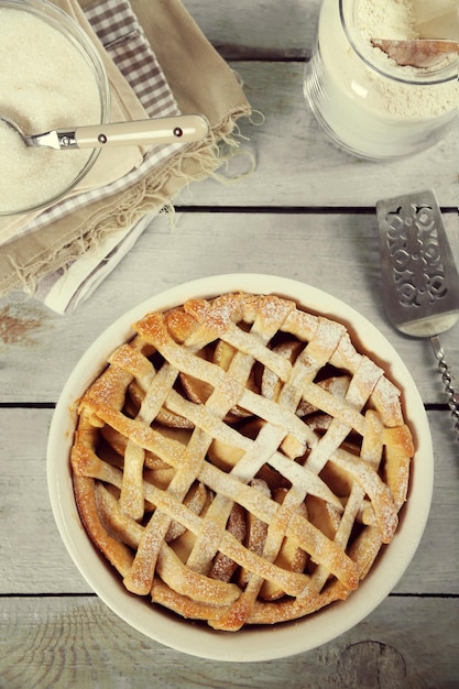 Homemade apple pie on wooden background