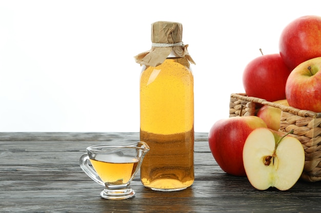 Homemade apple vinegar isolated on white