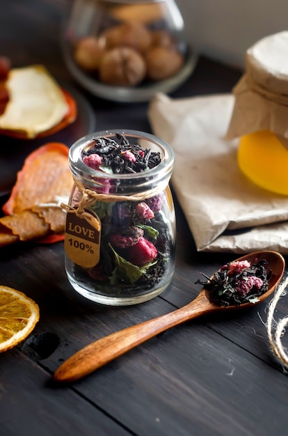 Homemade assorted fruit leather and dried chips in plate on wooden table