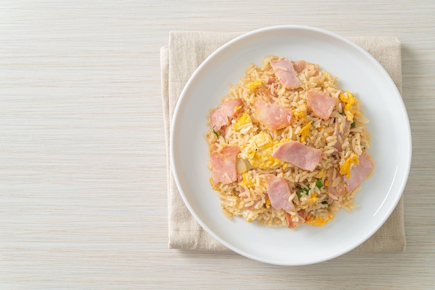 homemade bacon ham fried rice on white plate