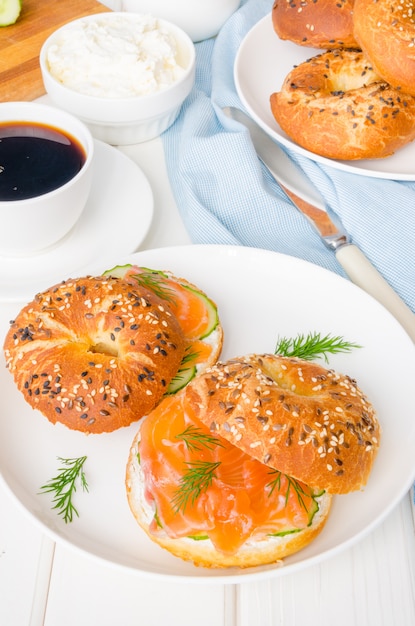 Homemade bagels with cream cheese, cucumber and smoked salmon for breakfast