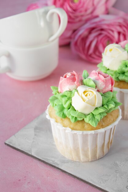 Homemade baked cupcake with cream for a birthday holiday