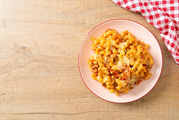 homemade baked macaroni bolognese with cheese - Italian food style