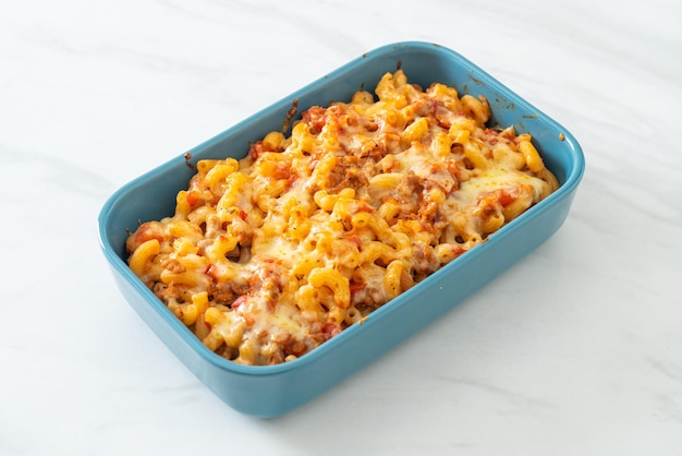 homemade baked macaroni bolognese with cheese - Italian food style