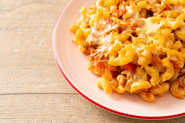 homemade baked macaroni bolognese with cheese - Italian food style