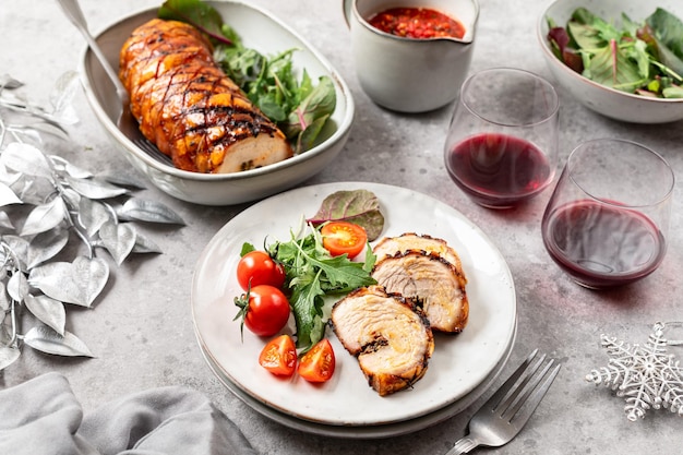 Homemade baked porchetta in rolls with several herbs pepper and garlic