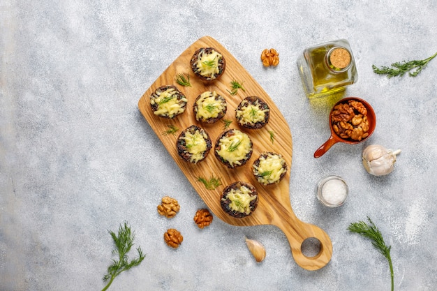 Homemade baked stuffed champignon mushrooms with fresh dill and Cheese