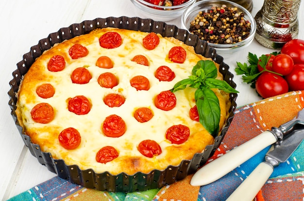 Homemade baking. Cherry tomato snack pie. Studio Photo.